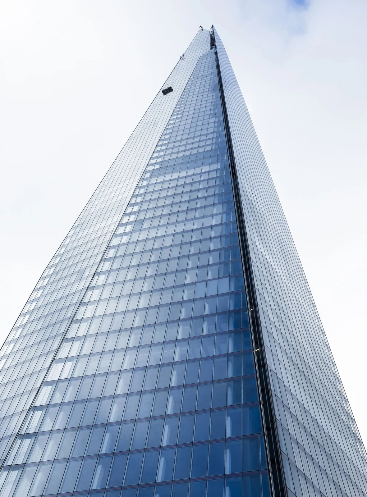 Glass tower façade with a crisp exposed aluminium grid