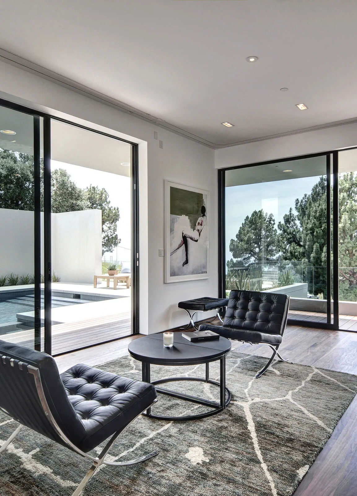 Screened sliding window above a low sideboard in a bright interior
